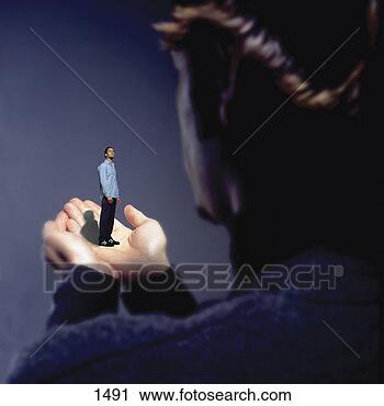 Stock Photography - man standing on 
hand. fotosearch 
- search stock 
photos, pictures, 
images, and photo 
clipart