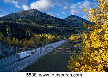 Stock Photo - semi truck on 
small two lane 
mountain highway 
in fall. fotosearch 
- search stock 
photos, pictures, 
images, and photo 
clipart