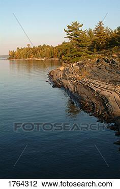 Stock Photo - a scenic lake 
edge. fotosearch 
- search stock 
photos, pictures, 
images, and photo 
clipart