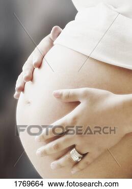 Stock Photo - expecting mother. 
fotosearch - search 
stock photos, 
pictures, images, 
and photo clipart