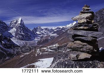 Stock Photography - mountainous terrain 
with stone monument 
in foreground. 
fotosearch - search 
stock photos, 
pictures, images, 
and photo clipart