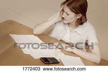 Stock Photo - single mom stressed 
about bills. fotosearch 
- search stock 
photos, pictures, 
images, and photo 
clipart