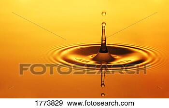 Stock Photograph - split second drop 
of liquid. fotosearch 
- search stock 
photos, pictures, 
images, and photo 
clipart