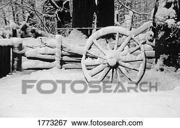 Picture - wagon wheel covered 
in snow. fotosearch 
- search stock 
photos, pictures, 
images, and photo 
clipart
