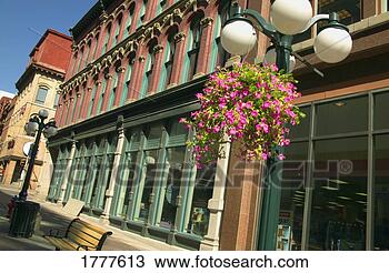 Stock Photo - old fashioned 
shop frontage 
and street. fotosearch 
- search stock 
photos, pictures, 
images, and photo 
clipart