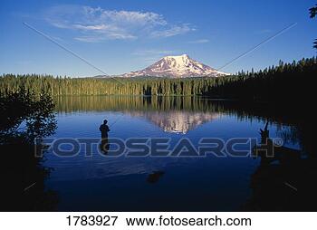 Picture - fisherman in takhlakh 
lake with reflection 
of distant mount 
adams. fotosearch 
- search stock 
photos, pictures, 
images, and photo 
clipart