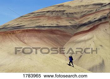 Stock Image - hiker, painted 
hills desert, 
john day national 
fossil beds. fotosearch 
- search stock 
photos, pictures, 
images, and photo 
clipart