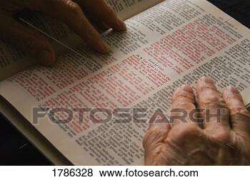 Stock Photo - closeup of senior 
reading bible. 
fotosearch - search 
stock photos, 
pictures, images, 
and photo clipart