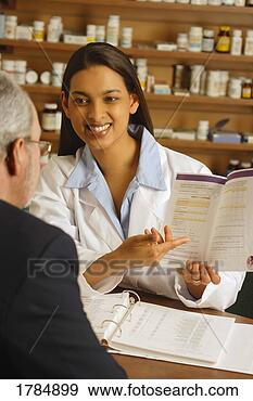 Stock Photograph - pharmacist giving 
patient medical 
advice. fotosearch 
- search stock 
photos, pictures, 
images, and photo 
clipart