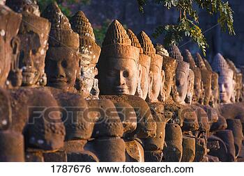 Stock Photo - buddha head statues, 
angkor wat temple. 
fotosearch - search 
stock photos, 
pictures, images, 
and photo clipart