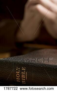 Stock Photo - closeup of bible 
with praying hands. 
fotosearch - search 
stock photos, 
pictures, images, 
and photo clipart