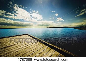 Stock Image - dock overlooking 
a lake. fotosearch 
- search stock 
photos, pictures, 
images, and photo 
clipart