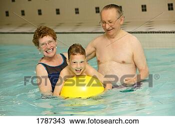 Stock Photo - grandparents and 
grandson in swimming 
pool. fotosearch 
- search stock 
photos, pictures, 
images, and photo 
clipart