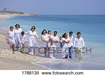Stock Image - large family walking 
on beach. fotosearch 
- search stock 
photos, pictures, 
images, and photo 
clipart