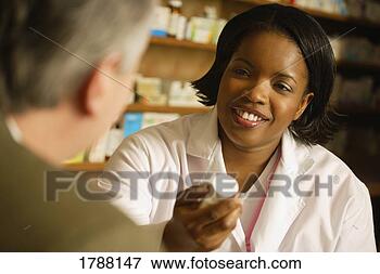Picture - pharmacist in 
consultation. 
fotosearch - search 
stock photos, 
pictures, images, 
and photo clipart