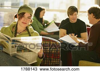 Stock Photo - a young woman 
reads the newspaper 
among other individuals. 
fotosearch - search 
stock photos, 
pictures, images, 
and photo clipart