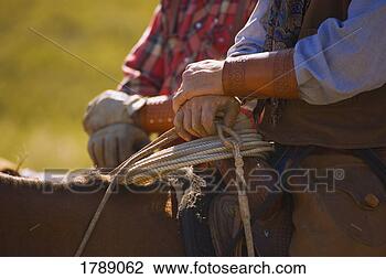 Stock Photo - cowboys on horseback. 
fotosearch - search 
stock photos, 
pictures, images, 
and photo clipart