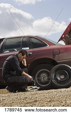 Stock Image - tire frustrations 
at roadside. fotosearch 
- search stock 
photos, pictures, 
images, and photo 
clipart