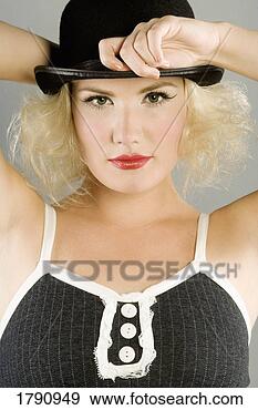 Stock Photograph - young women with 
a  hat. fotosearch 
- search stock 
photos, pictures, 
images, and photo 
clipart