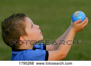Stock Photo - boy offering the 
world. fotosearch 
- search stock 
photos, pictures, 
images, and photo 
clipart