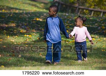 Stock Photography - brother and sister 
walking together. 
fotosearch - search 
stock photos, 
pictures, images, 
and photo clipart