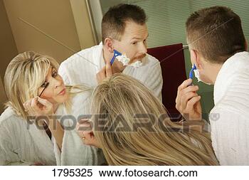 Stock Image - couple getting 
ready in the morning. 
fotosearch - search 
stock photos, 
pictures, images, 
and photo clipart