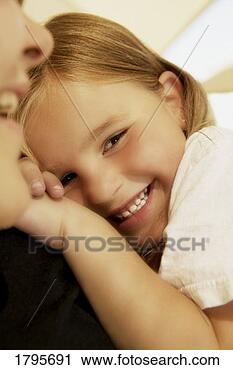 Stock Photography - girl resting on 
her mother's shoulder. 
fotosearch - search 
stock photos, 
pictures, images, 
and photo clipart