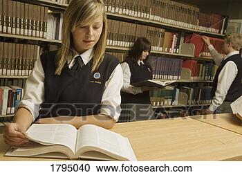 Stock Photography - students in the 
library. fotosearch 
- search stock 
photos, pictures, 
images, and photo 
clipart