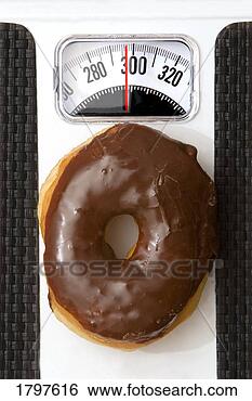 Stock Photo - donut tipping 
the scale. fotosearch 
- search stock 
photos, pictures, 
images, and photo 
clipart