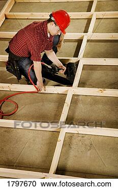 Stock Photography - high angle view 
of a tradesman. 
fotosearch - search 
stock photos, 
pictures, images, 
and photo clipart