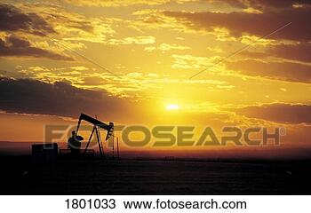 Stock Photo - oil well in a 
sunset. fotosearch 
- search stock 
photos, pictures, 
images, and photo 
clipart