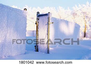 Stock Photo - snowy fence with 
gate open. fotosearch 
- search stock 
photos, pictures, 
images, and photo 
clipart
