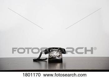 Stock Photography - telephone on desk. 
fotosearch - search 
stock photos, 
pictures, images, 
and photo clipart