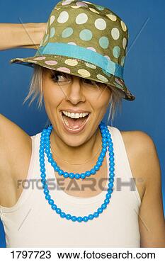 Stock Photo - woman wearing 
a hat and necklace. 
fotosearch - search 
stock photos, 
pictures, images, 
and photo clipart