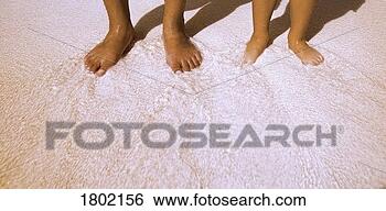 Stock Photo - barefoot on the 
beach. fotosearch 
- search stock 
photos, pictures, 
images, and photo 
clipart
