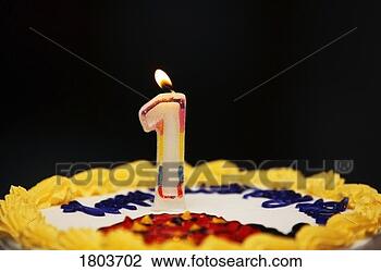 Stock Photo - a birthday cake 
with lit candle. 
fotosearch - search 
stock photos, 
pictures, images, 
and photo clipart