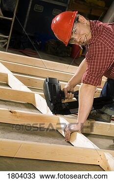 Stock Photo - content carpenter 
working with power 
tool. fotosearch 
- search stock 
photos, pictures, 
images, and photo 
clipart
