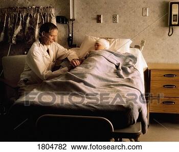 Stock Photo - doctor checking 
on a child in 
a hospital room. 
fotosearch - search 
stock photos, 
pictures, images, 
and photo clipart