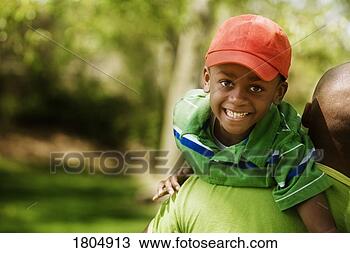 Stock Photo - father carrying 
son on shoulders. 
fotosearch - search 
stock photos, 
pictures, images, 
and photo clipart