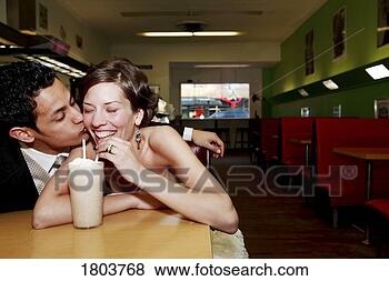 Stock Photo - front view of 
a couple drinking 
in a restaurant. 
fotosearch - search 
stock photos, 
pictures, images, 
and photo clipart