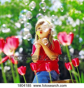 Stock Image - a girl blowing 
bubbles. fotosearch 
- search stock 
photos, pictures, 
images, and photo 
clipart