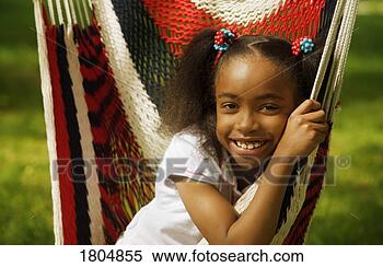 Stock Image - girl sitting in 
hammock. fotosearch 
- search stock 
photos, pictures, 
images, and photo 
clipart
