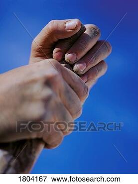Picture - hands holding 
stick against 
blue sky. fotosearch 
- search stock 
photos, pictures, 
images, and photo 
clipart
