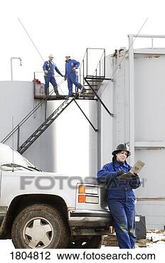 Stock Photo - industrial workers 
at an oilfield. 
fotosearch - search 
stock photos, 
pictures, images, 
and photo clipart