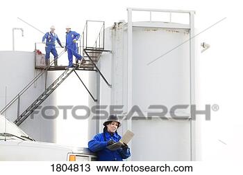 Stock Photo - industrial workers 
at an oilfield. 
fotosearch - search 
stock photos, 
pictures, images, 
and photo clipart