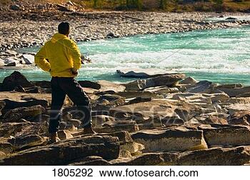 Stock Photo - man overlooking 
a mountain river. 
fotosearch - search 
stock photos, 
pictures, images, 
and photo clipart