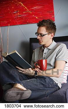 Stock Photo - a man reading 
book. fotosearch 
- search stock 
photos, pictures, 
images, and photo 
clipart
