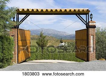Stock Photo - open entrance 
gate with mountain 
view in andalucia, 
spain. fotosearch 
- search stock 
photos, pictures, 
images, and photo 
clipart