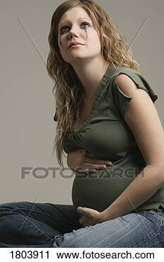 Stock Photography - a pensive pregnant 
woman. fotosearch 
- search stock 
photos, pictures, 
images, and photo 
clipart