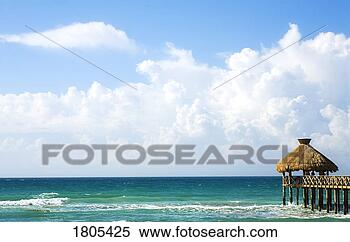 Stock Image - pier overlooking 
sea with white 
clouds. fotosearch 
- search stock 
photos, pictures, 
images, and photo 
clipart
